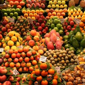 A large display of fruits and vegetables for sale